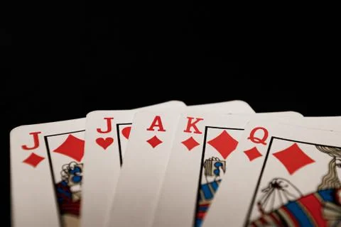 Red euchre diamond hand on black background Stock Photos