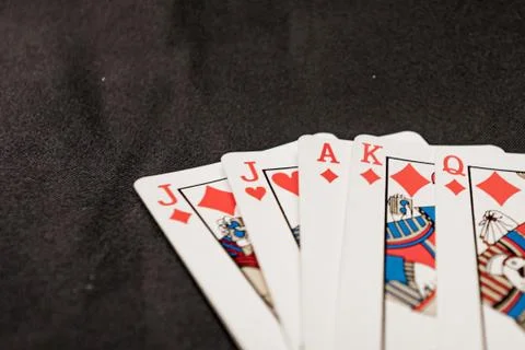 Red euchre diamond hand on black background Stock Photos