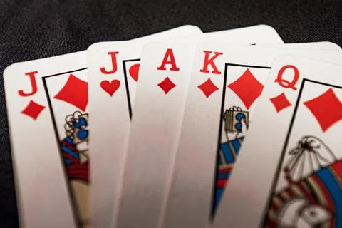 Red euchre diamond hand on black background Stock Photos