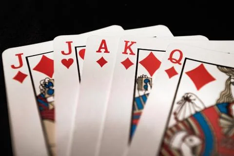 Red euchre diamond hand on black background Stock Photos
