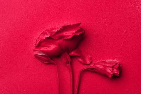 Red eustoma flower on a red paper background. Foto stock