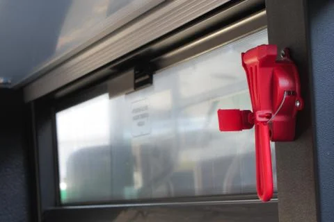Red evacuation hammer on public transport Foto stock
