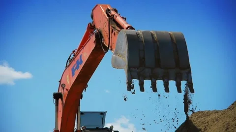 Red excavator working on a construction site 動画素材 7727744