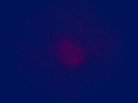 Red explosive particles in deep blue background Stock Illustration