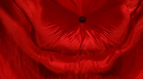 Red fabric and a ball, Slow Motion Stock Footage