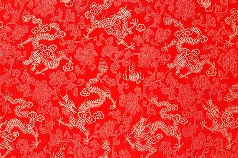 Red fabric with a dragon pattern. The concept of the Chinese New Year Stock Photos