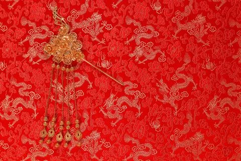 Red fabric with dragon pattern with red copy space for text Stock Photos