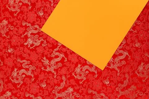 Red fabric with dragon pattern with yellow copy space for text. Stock Photos