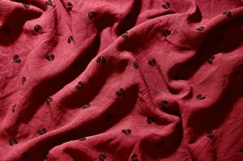 Red Fabric with Heart Pattern Background with Soft Waves 写真素材