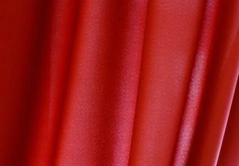 A red fabric with a pattern of dots Stock Photos
