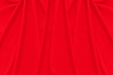 Red fabric texture background. Abstract cloth backdrop with soft waves. Stock Photos