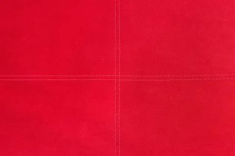 Red fabric texture for background stitched with white threads Stock Photos