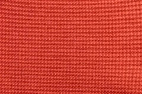 Red fabric texture. Textile. Canvas. Pattern on fabric with intersecting line Stock Photos