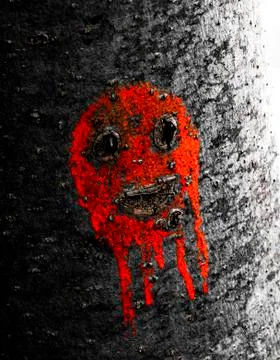 Red face in a green tree Stock Photos