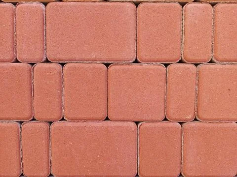 Red facing tiles in the wall background Stock Photos