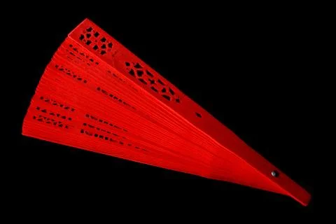 Red fan with a pattern closeup. Isolate on black background 스톡 사진