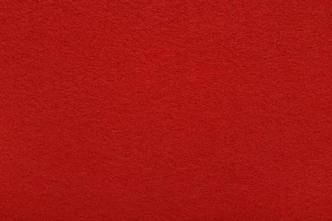 Red felt texture background - close-up of soft fabric surface. Stock Photos