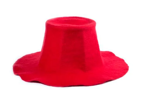 Red felt wool hat on a white background Foto stock
