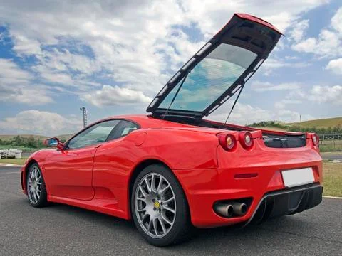 Red ferrari f430 with tailgate open Stock Photos