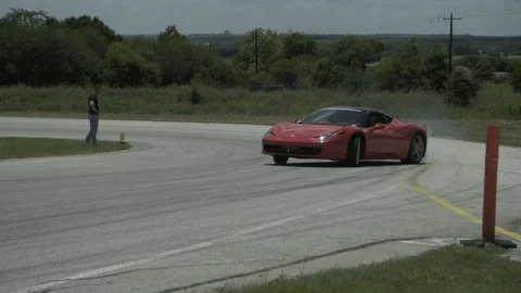 Red Ferrari Slow Motion Drift Drive By At Full Speed Video stock 120149606