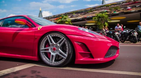 Red Ferrari in slow motion low angle passing by Stock Footage 40100795