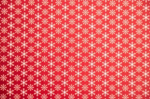 Red festive background with white snowflake pattern for holiday decor Foto stock