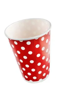 Red festive paper cups with a pattern of white peas. + clipping path Foto stock
