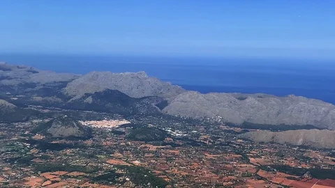 Red fields and mountains of the Spanish island of Mallorca divided into squares Stock Footage 116158825