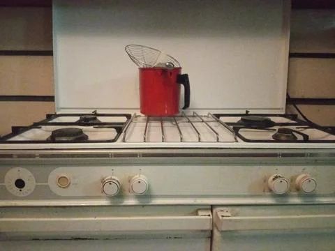 Red filter on the stove on the kitchen Stock Photos
