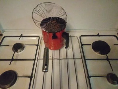 Red filter on the stove on the kitchen Stock Photos