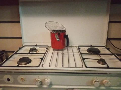 Red filter on the stove on the kitchen Stock Photos