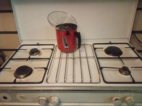 Red filter on the stove on the kitchen Stock Photos