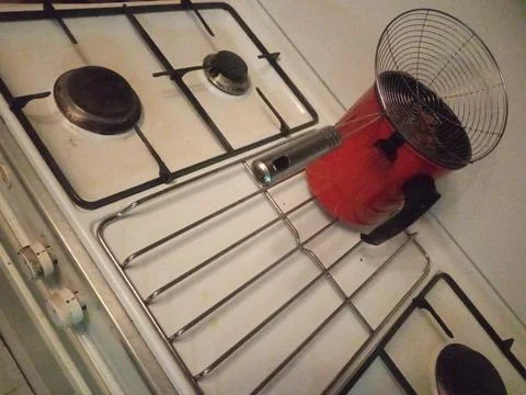 Red filter on the stove on the kitchen Stock Photos