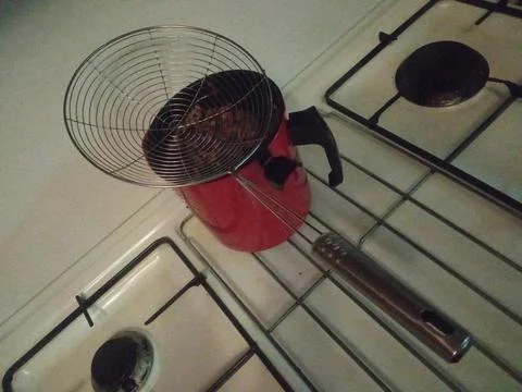 Red filter on the stove on the kitchen Stock Photos