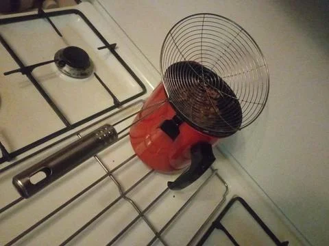 Red filter on the stove on the kitchen Stock Photos
