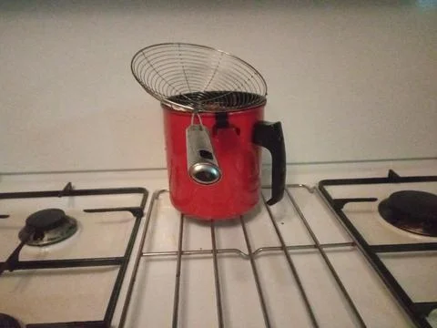 Red filter on the stove on the kitchen Stock Photos