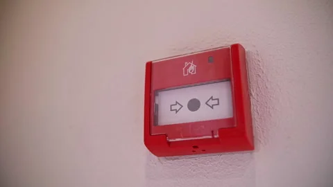 Red fire alarm button on the wall Stock Footage 241712682