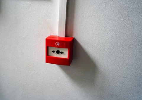 Red fire alarm button on a wall Stock Photos