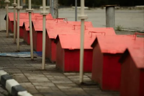 Red fire boxes with sand stand in line on refill ,equipment and tools, Vintag Stock Photos