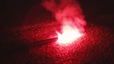 Red fire burns on the pavement Stock Footage 130737765
