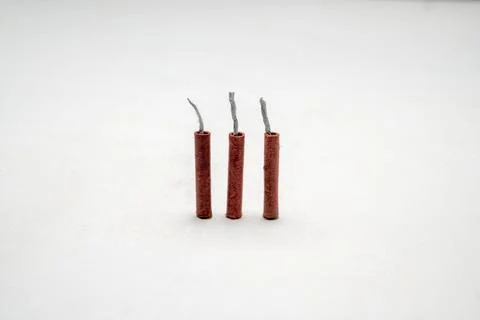 Red fire crackers isolated over white background Foto stock