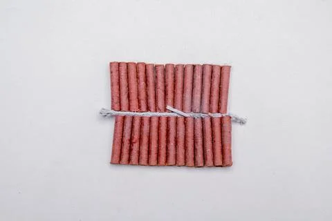Red fire crackers string isolated over white background Stock Photos
