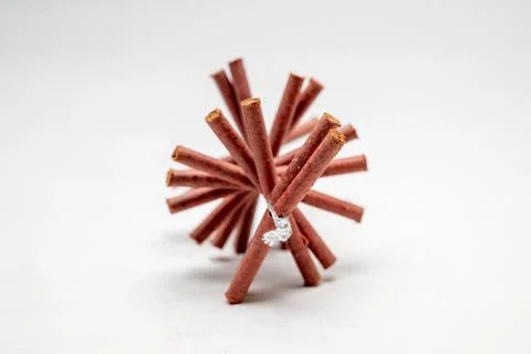 Red fire crackers string isolated over white background Stock Photos
