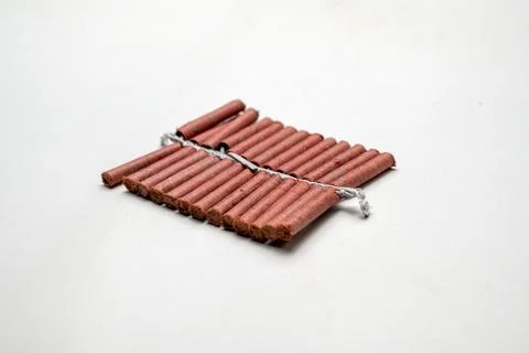 Red fire crackers string isolated over white background Stock Photos