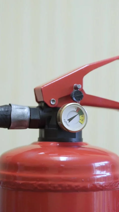 Red fire extinguisher on light background Stock Footage 286102619