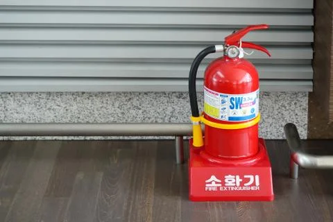 Red fire extinguisher Stock Photos