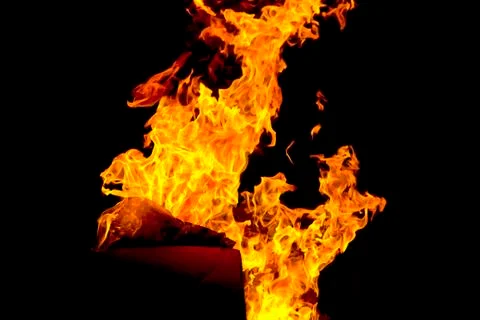 Red fire flame on black background Stock Photos