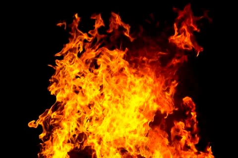 Red fire flame on black background Stock Photos