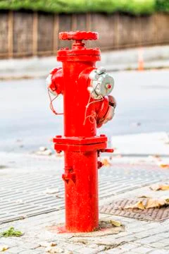Red fire hydrant in the city Stock Photos