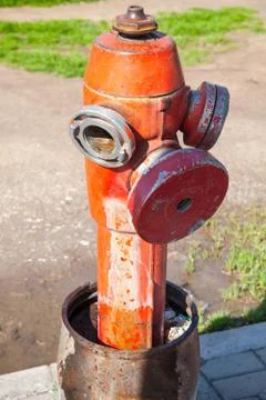 Red fire hydrant, close up vertical photo Stock Photos